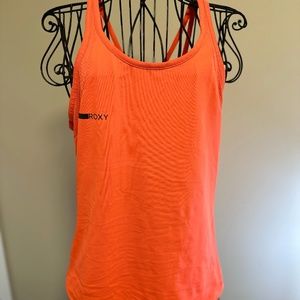 Roxy | Coral athletic tank top with criss cross strap detail